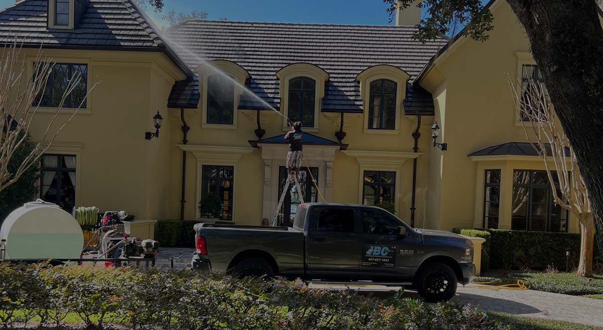 JBC Pressure Washing crew performing roof soft wash in Orlando FL